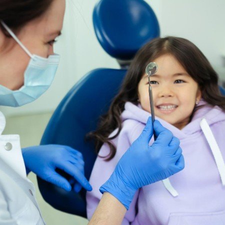 Little girl with dentist